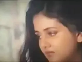 Seductive Indian film star in a steamy scene wearing a swimsuit